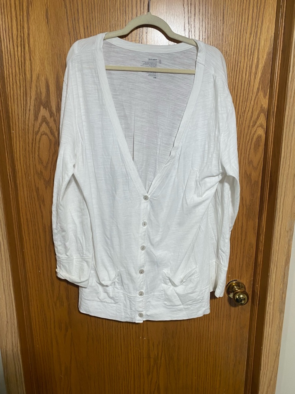 Really cute plunging V-neck sweater oversized in my opinion
